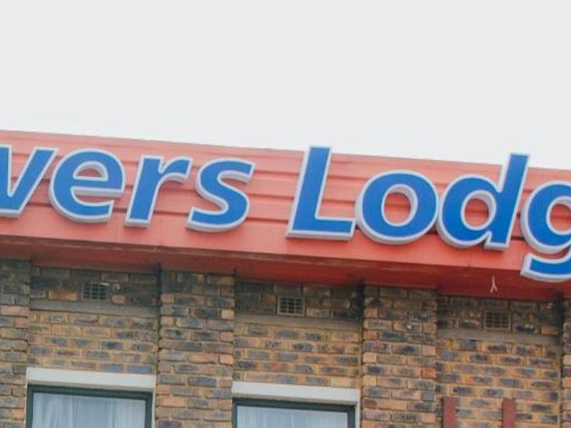 Close-up view of the Towers Lodge building signage mounted on a brick facade.