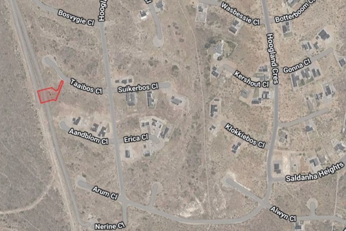 An aerial satellite view of the residential area showing the location of the vacant land plot highlighted in red.