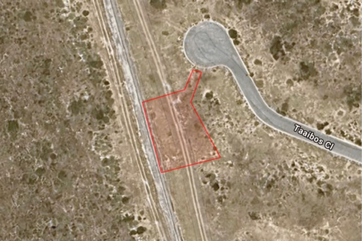 Aerial view of a vacant residential plot with direct access to Taaibos Close, showcasing the site boundaries and surrounding landscape.