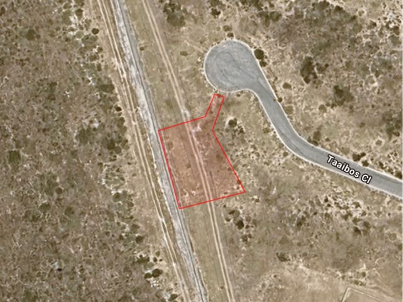 Aerial view of a vacant residential plot with direct access to Taaibos Close, showcasing the site boundaries and surrounding landscape.