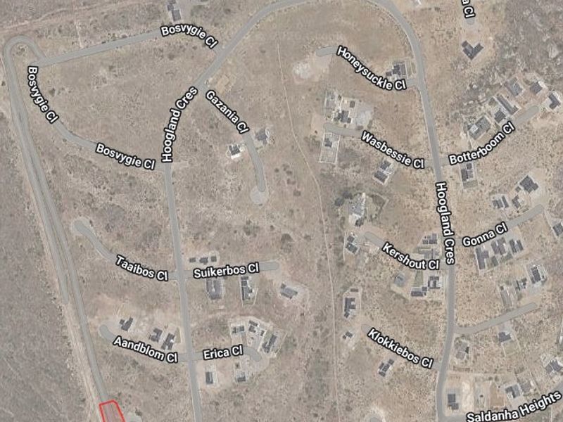 An aerial view of the residential estate showing the location of the vacant land plot highlighted in red.