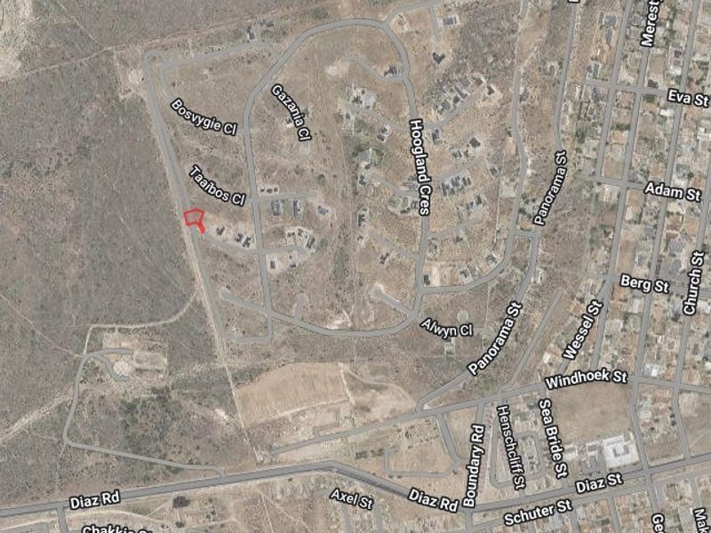An aerial satellite view showing the location of the vacant residential land plot within the surrounding neighborhood street layout.