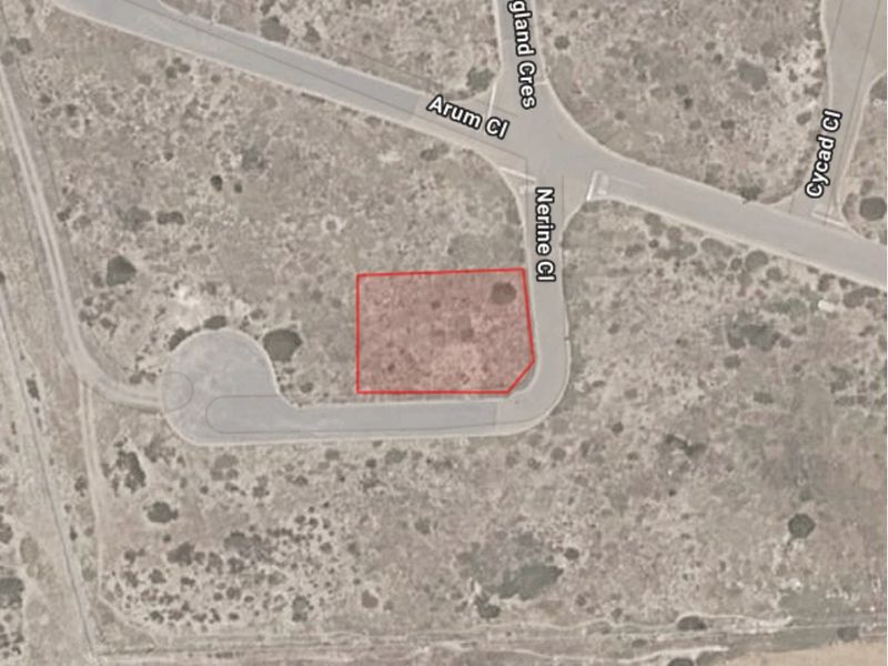 An aerial view showing the location and boundaries of the vacant residential land plot situated on a corner lot.