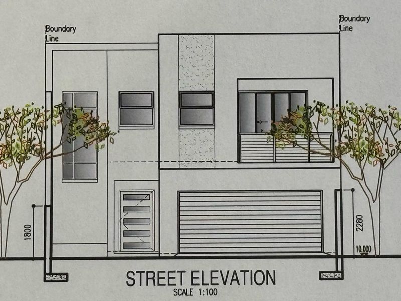 Architectural street elevation drawing showing the front facade design, including garage, entrance, and balcony details.