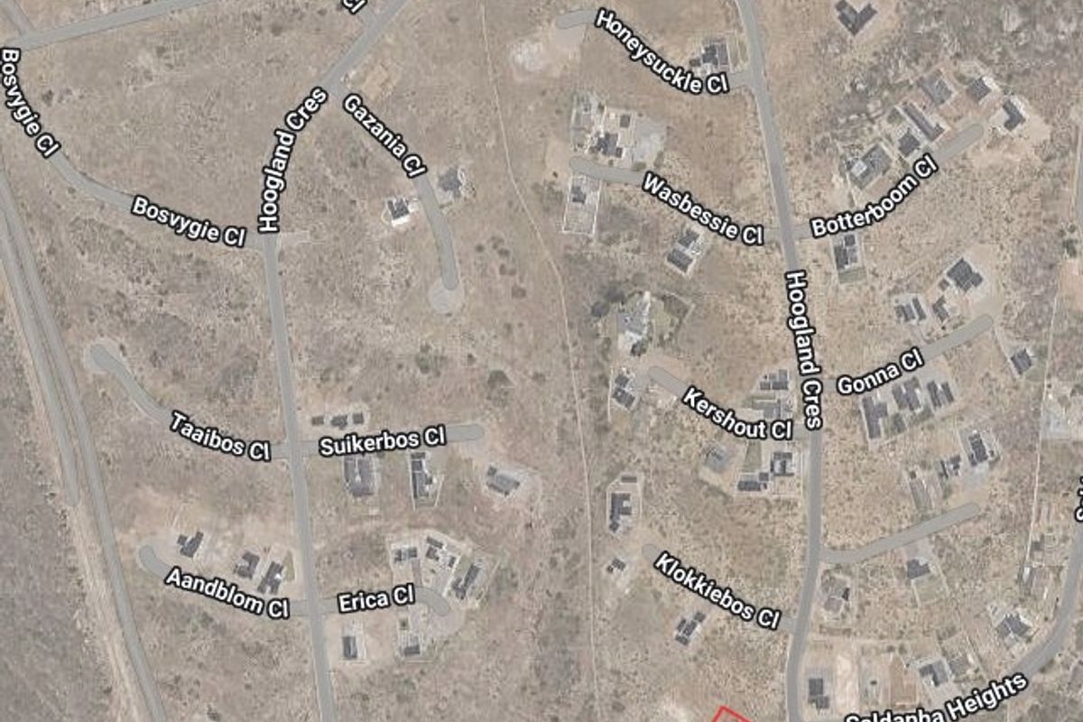 An aerial satellite view showing the residential land plot highlighted in red within the surrounding neighborhood street layout.