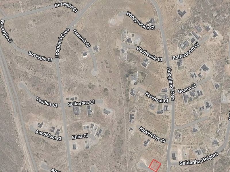 An aerial satellite view showing the residential land plot highlighted in red within the surrounding neighborhood street layout.