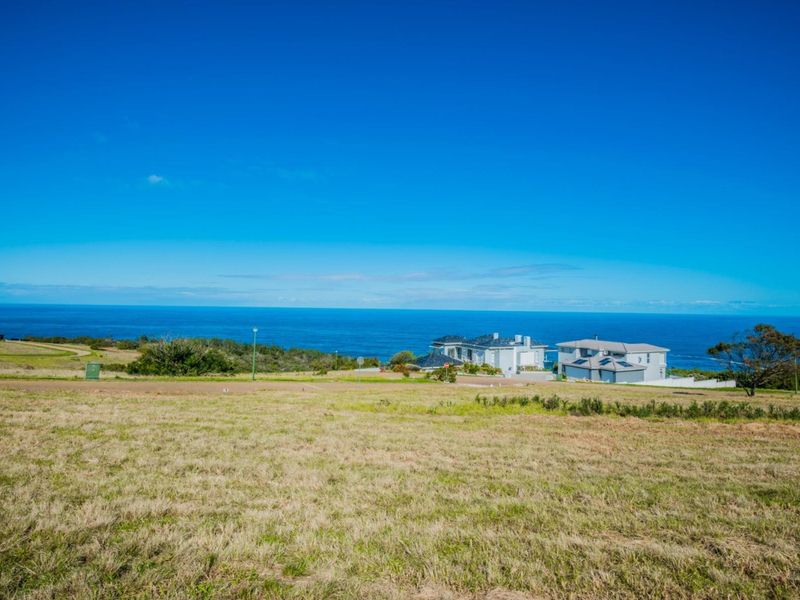 A scenic view of the ocean and coastal landscape from the vacant residential land.