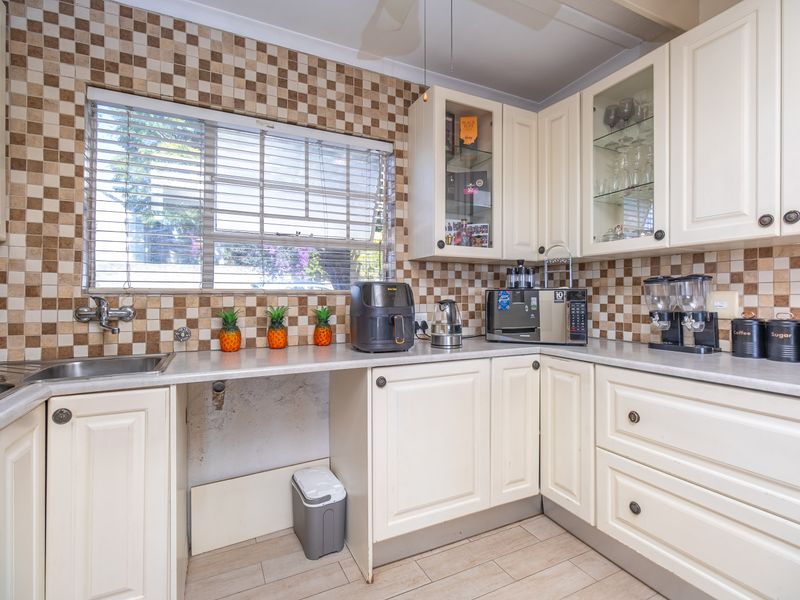 Charming Three-Bedroom Home with Cottage Appeal and Private Garden Oasis - Photo 10