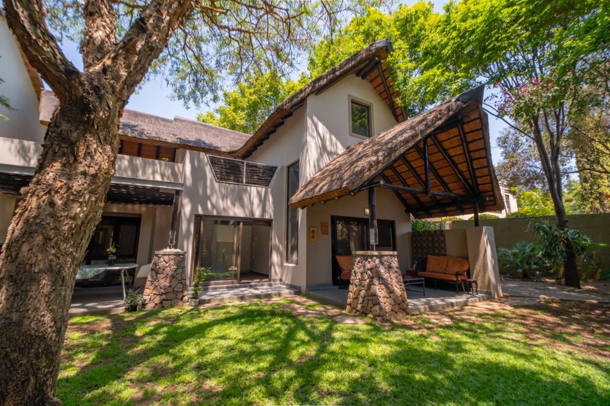 Corner Garden Unit with Loft and Wraparound Privacy within Sibiti Estate - Photo 2