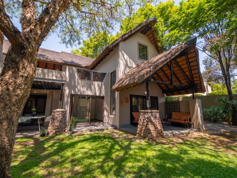 Corner Garden Unit with Loft and Wraparound Privacy within Sibiti Estate - Photo 2