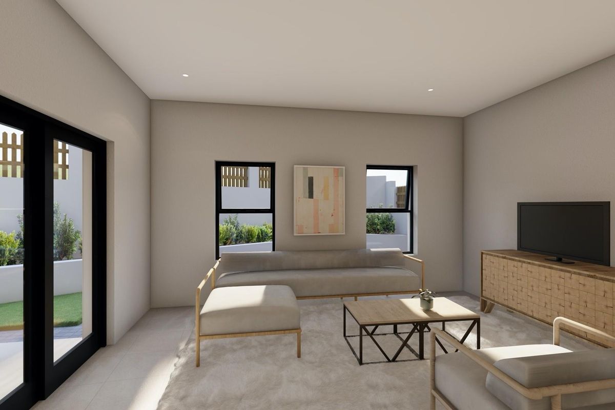A bright and modern living room featuring large windows, recessed lighting, and direct access to an outdoor patio area.