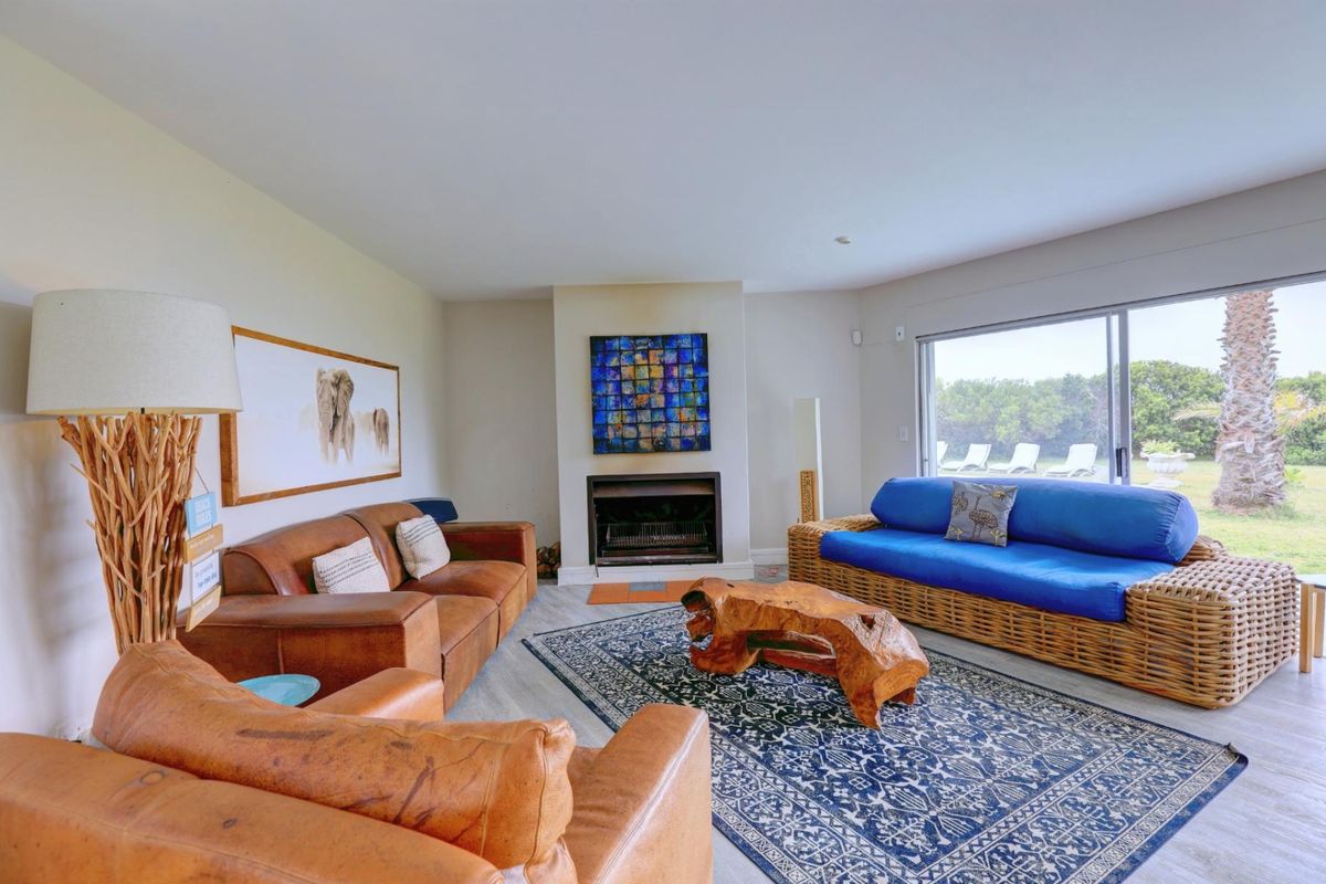 Spacious living room featuring a built-in fireplace and large sliding glass doors that provide natural light and access to the outdoor area.