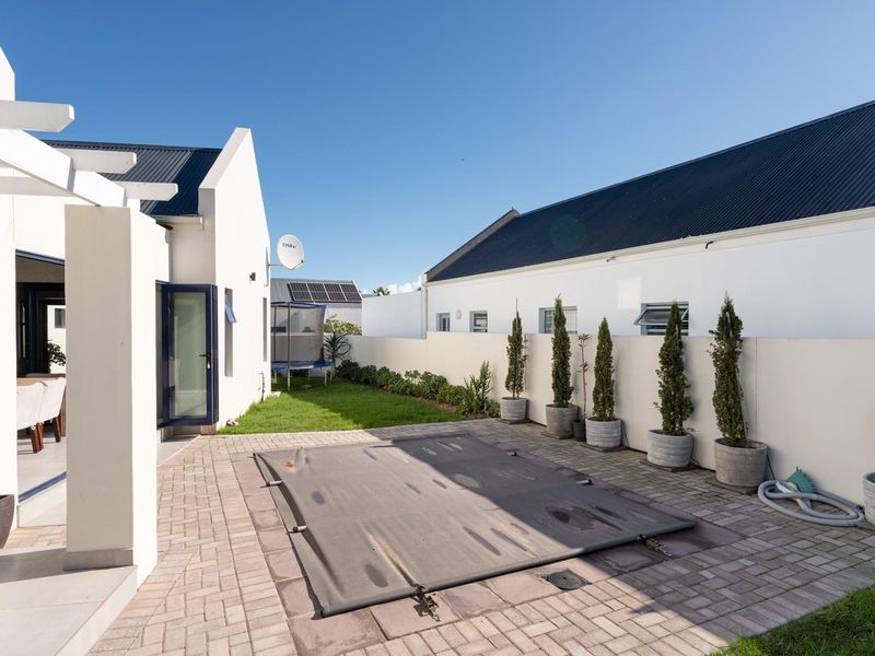 Modern 3-Bedroom Home with Pool in Sought-After Blue Lagoon - Photo 2