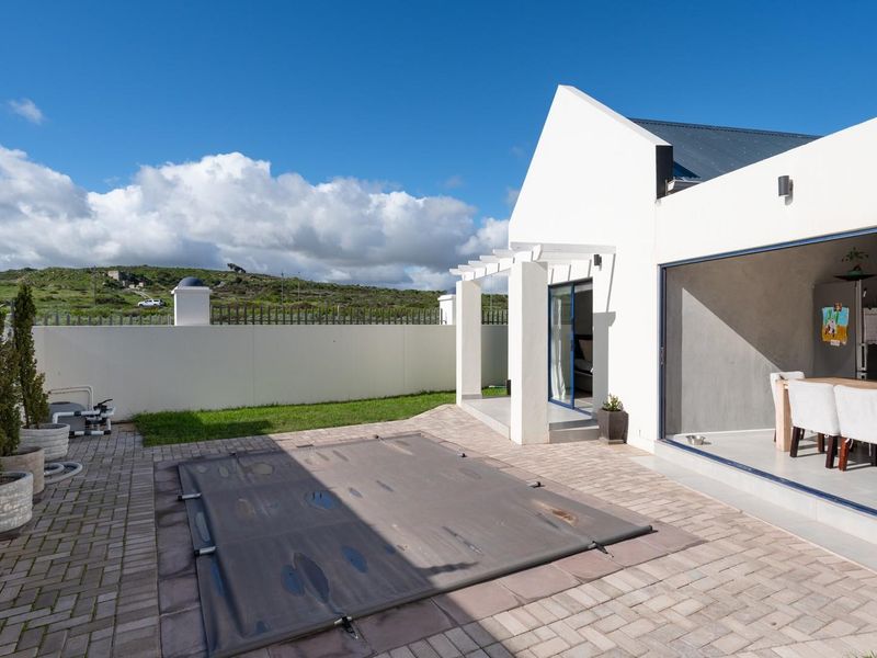 Modern 3-Bedroom Home with Pool in Sought-After Blue Lagoon - Photo 3