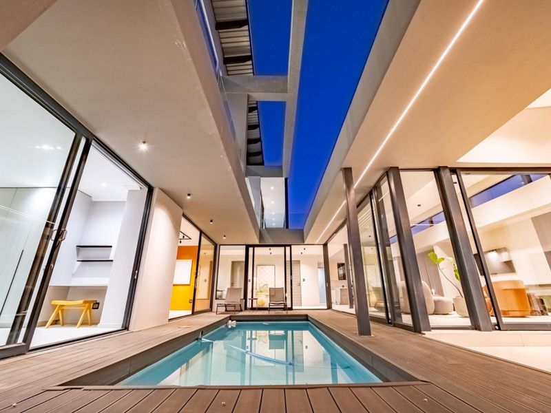 Architectural Four Bedroom Masterpiece with Dual Main Suites in Helderfontein Estate - Photo 2