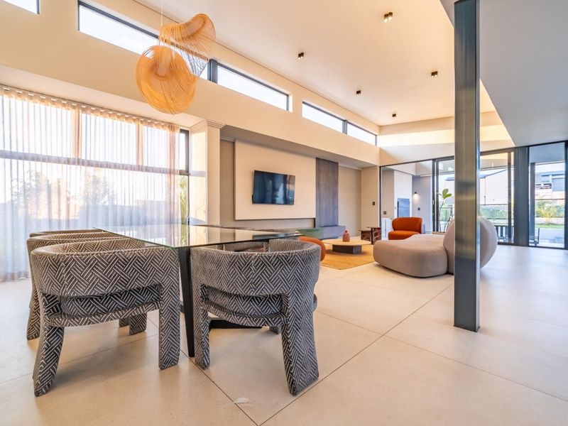 Architectural Four Bedroom Masterpiece with Dual Main Suites in Helderfontein Estate - Photo 4