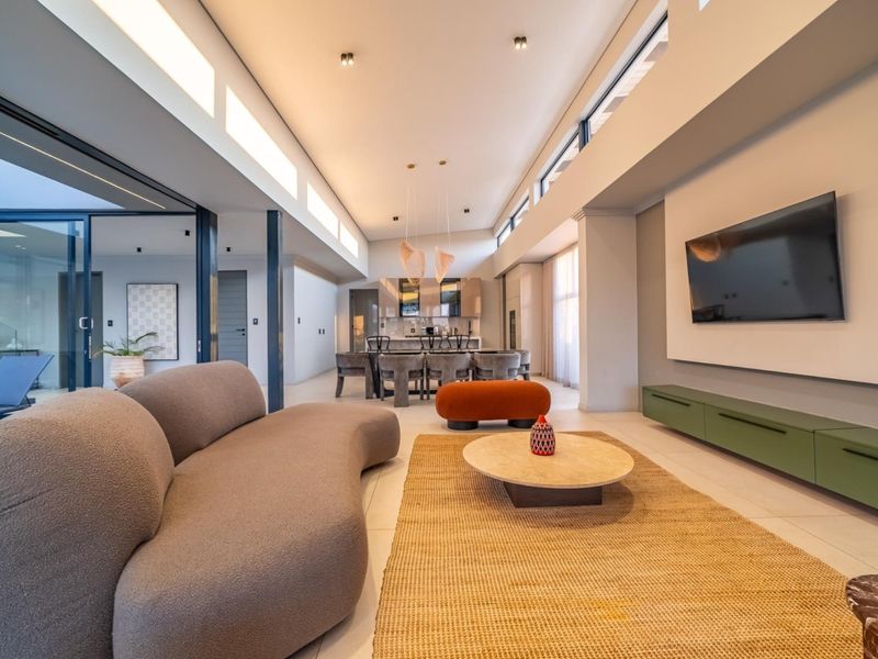 Architectural Four Bedroom Masterpiece with Dual Main Suites in Helderfontein Estate - Photo 8