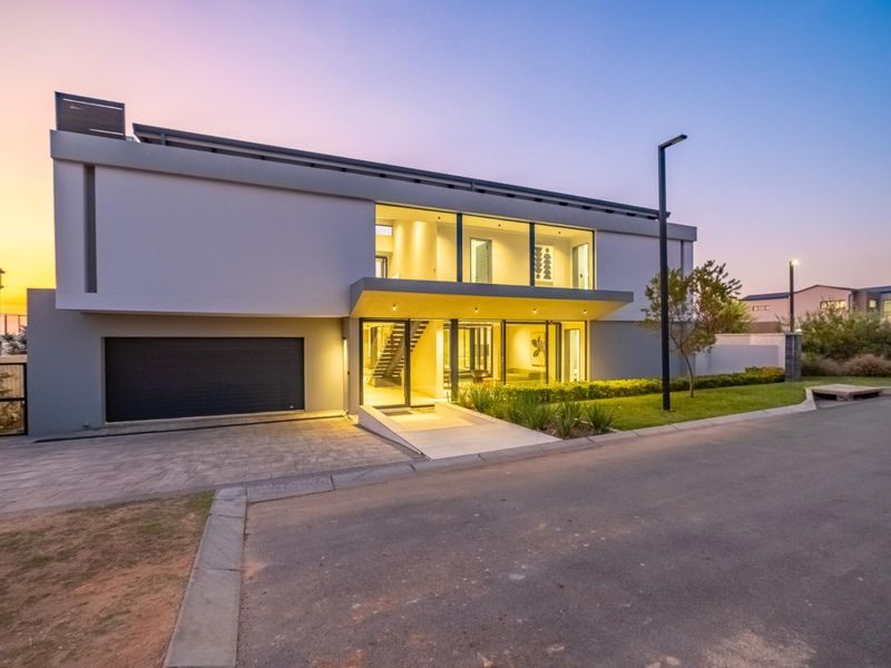 Architectural Four Bedroom Masterpiece with Dual Main Suites in Helderfontein Estate - Photo 1