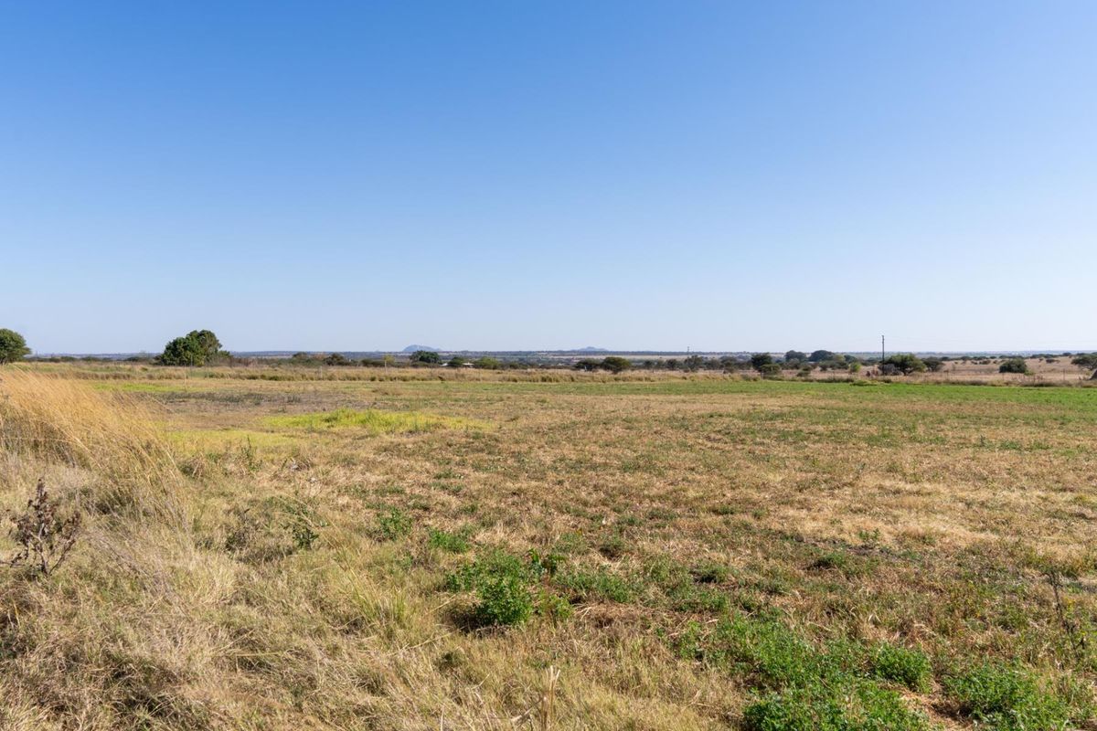 A wide, open view of the vacant residential land, showcasing the expansive landscape and natural terrain.