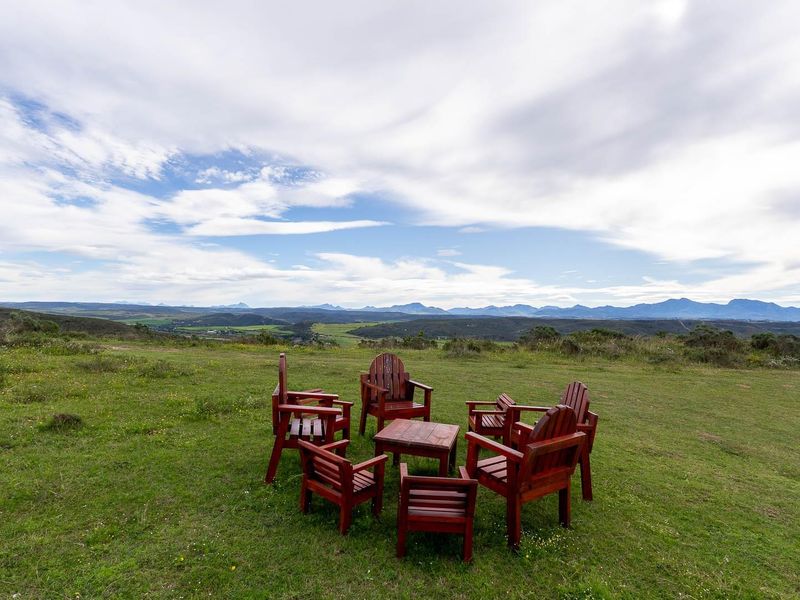 Expansive panoramic view of the surrounding landscape and distant mountain ranges from the vacant residential land.