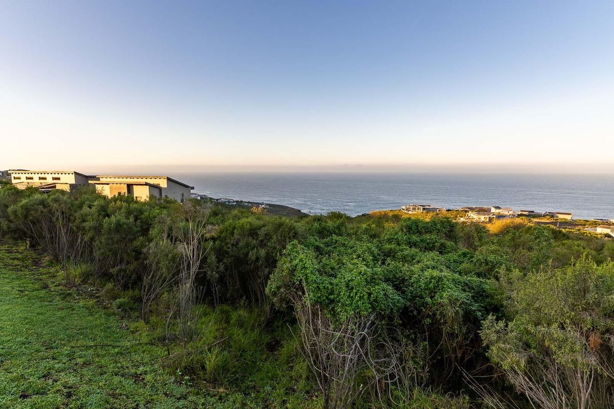 A scenic elevated view overlooking the coastline and surrounding landscape, showcasing the natural beauty and topography of the vacant residential land.