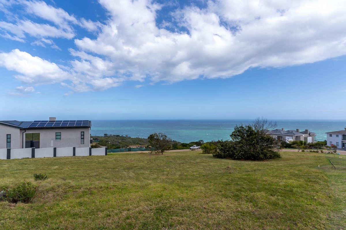 A scenic view overlooking the coastal landscape and ocean from the vacant residential property.