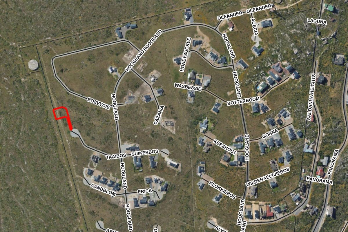 An aerial view of the residential estate showing the location of the vacant land plot highlighted in red.