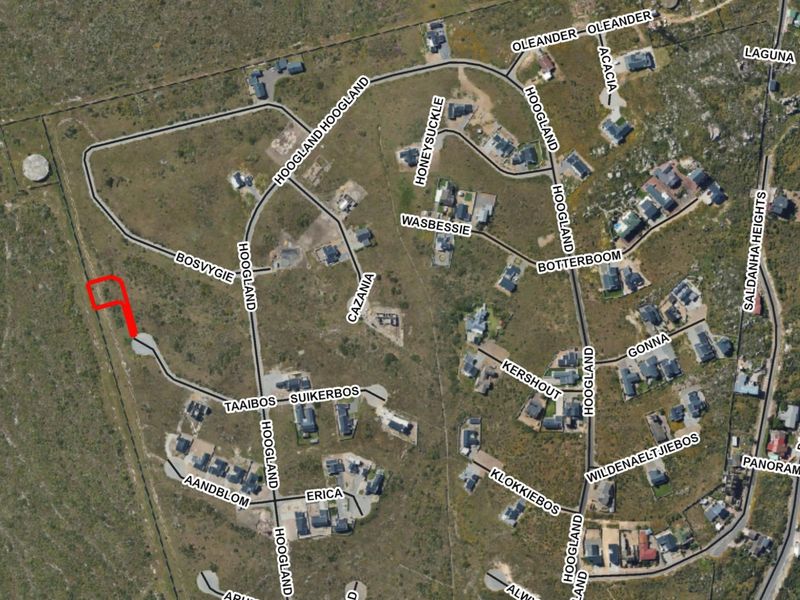 An aerial view of the residential estate showing the location of the vacant land plot highlighted in red.