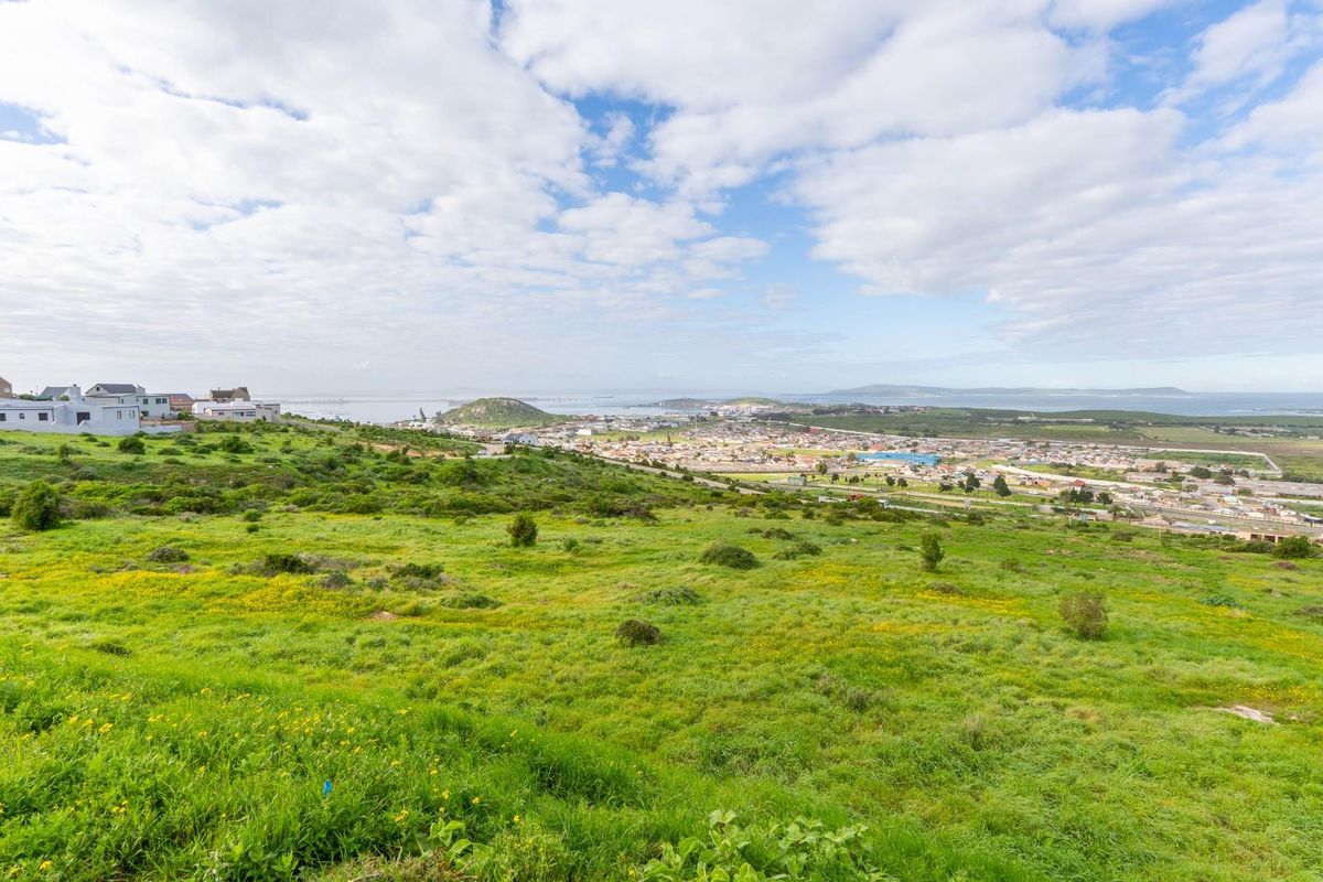 A wide-angle view of the vacant residential land overlooking the surrounding coastal town and landscape.