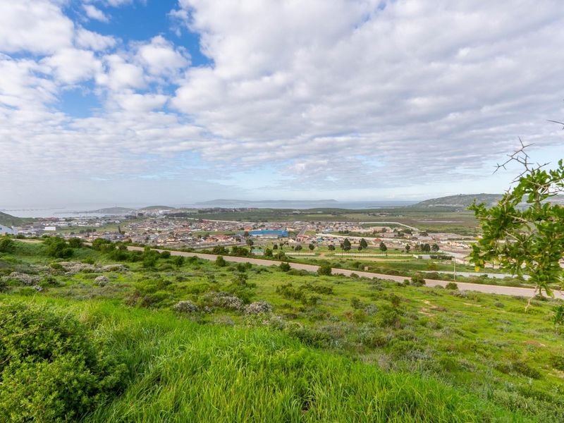 Expansive elevated view overlooking the surrounding residential landscape and distant coastal horizon.