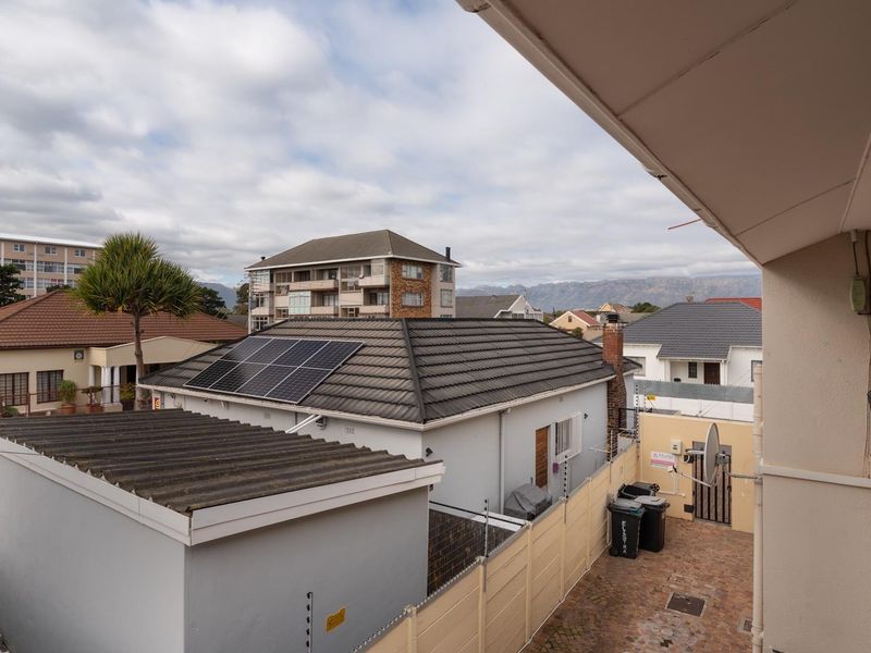 A view from an elevated balcony overlooking the surrounding residential neighborhood and rooftops.