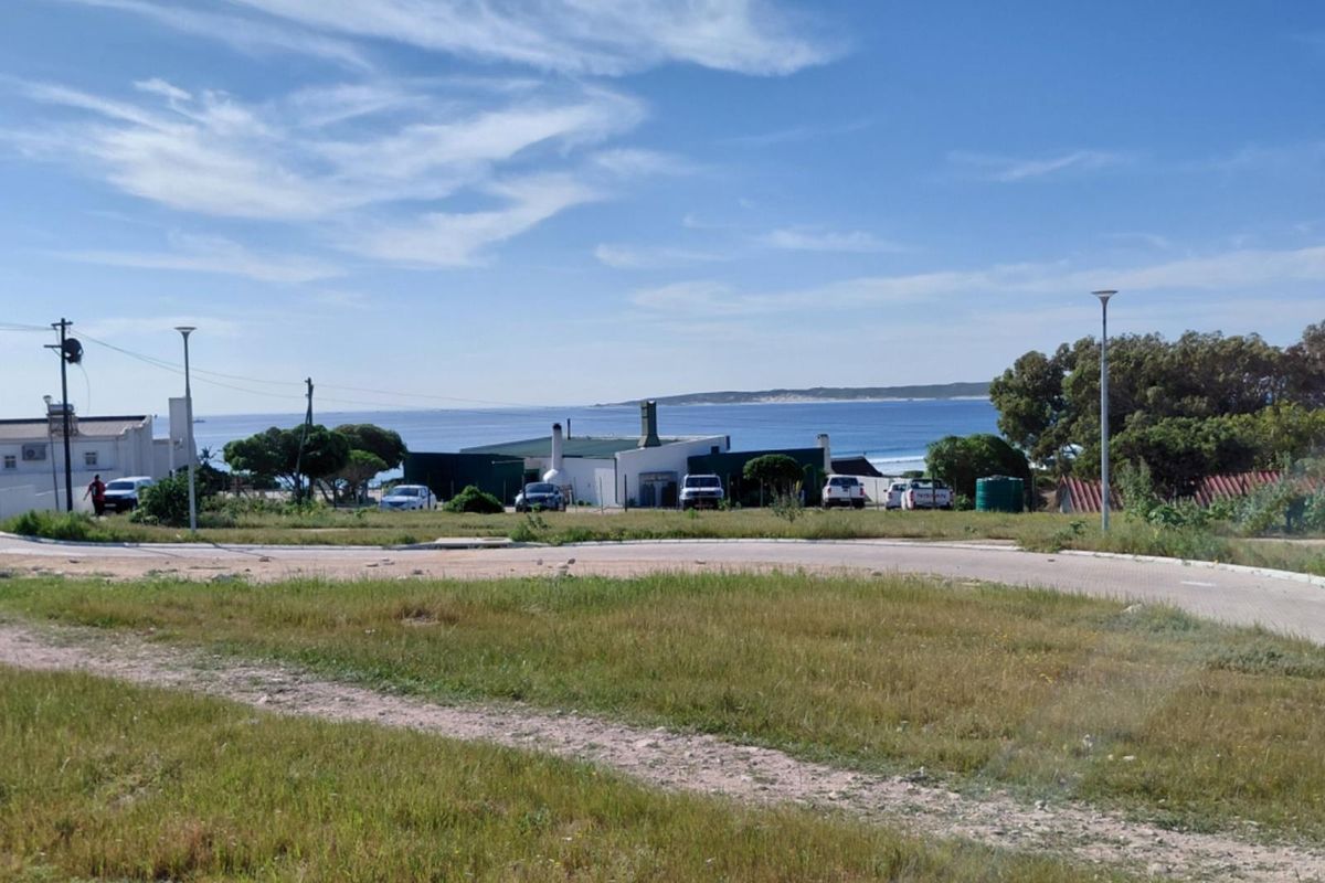 A view of the surrounding residential area and coastal landscape from the vacant land plot.
