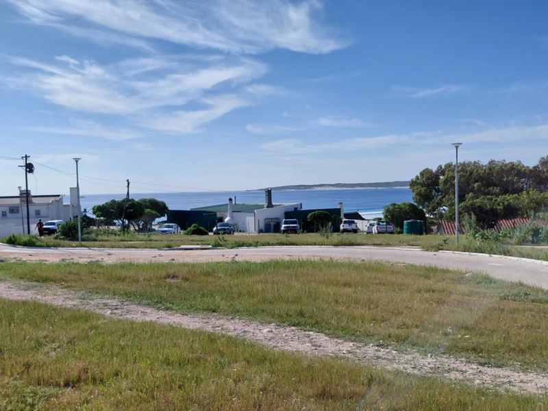 A view of the surrounding residential area and coastal landscape from the vacant land plot.