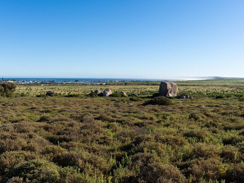 Expansive view of the natural landscape and coastal horizon from the vacant residential land.