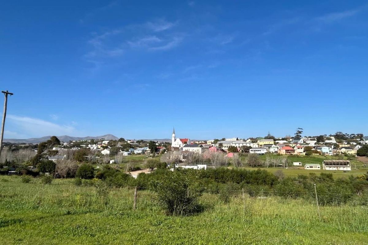 A scenic view of the surrounding residential landscape and town from the vacant land plot.