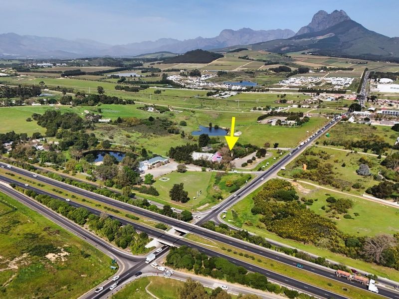 Aerial view of the commercial property location, highlighting its proximity to major highway infrastructure and surrounding rural landscape.