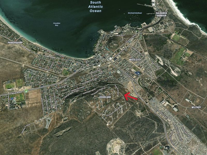 An aerial satellite view of the Hoogland area in Saldanha, with a red arrow indicating the specific location of the residential land parcel.