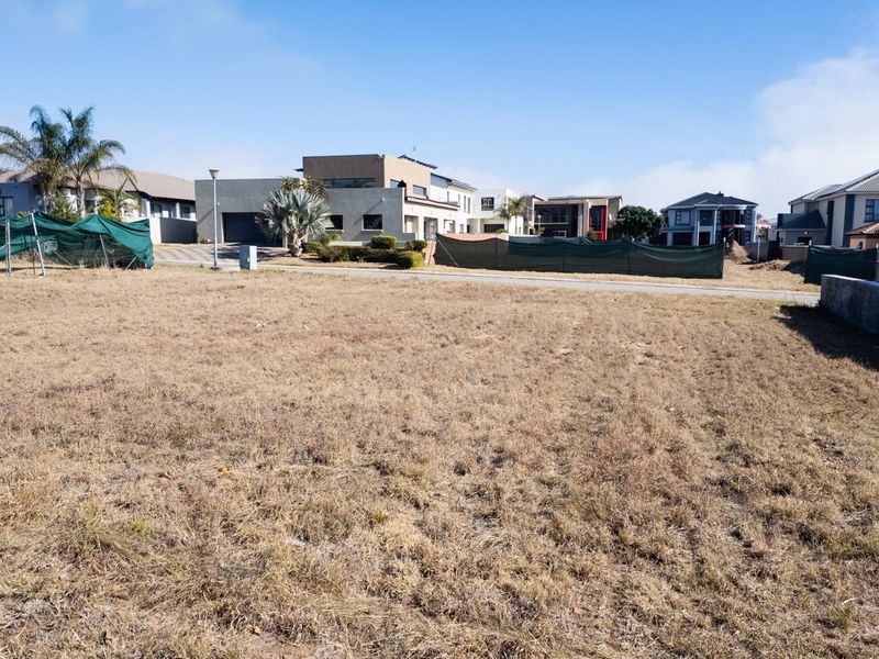 A vacant residential plot of land situated in a developed neighborhood, ready for new construction.
