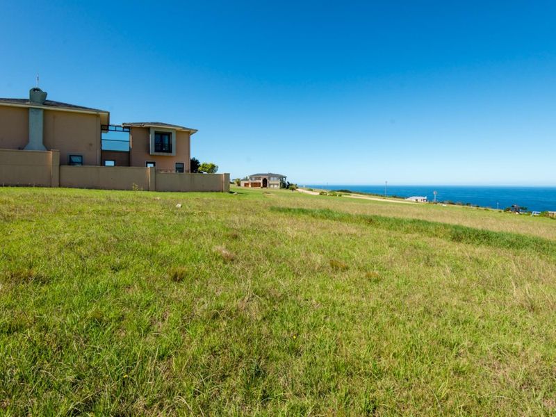 A scenic view of the ocean and coastal landscape from the vacant residential land.