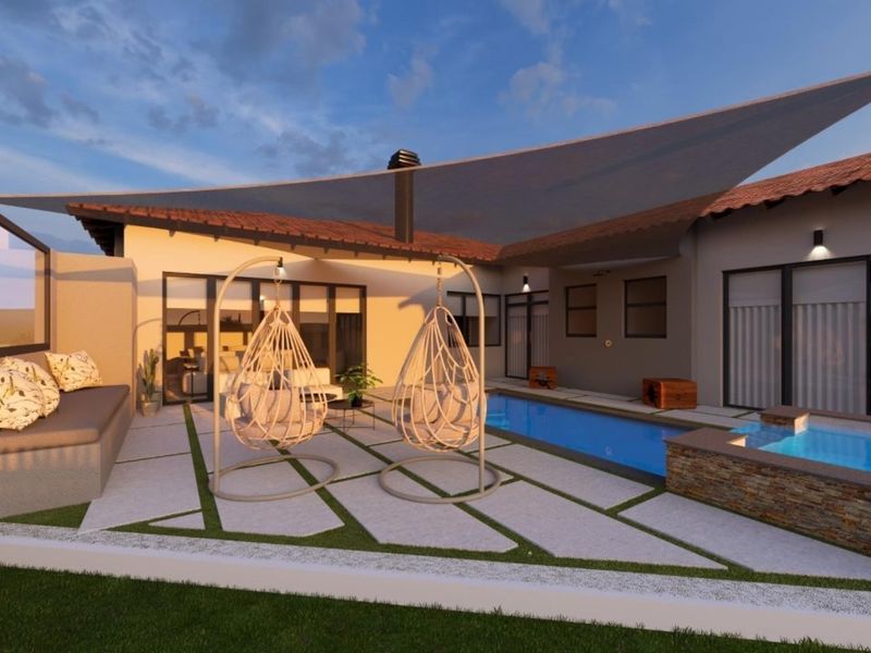 A modern outdoor entertainment area featuring a swimming pool, stone-clad water feature, paved patio, and integrated seating under a shade sail.