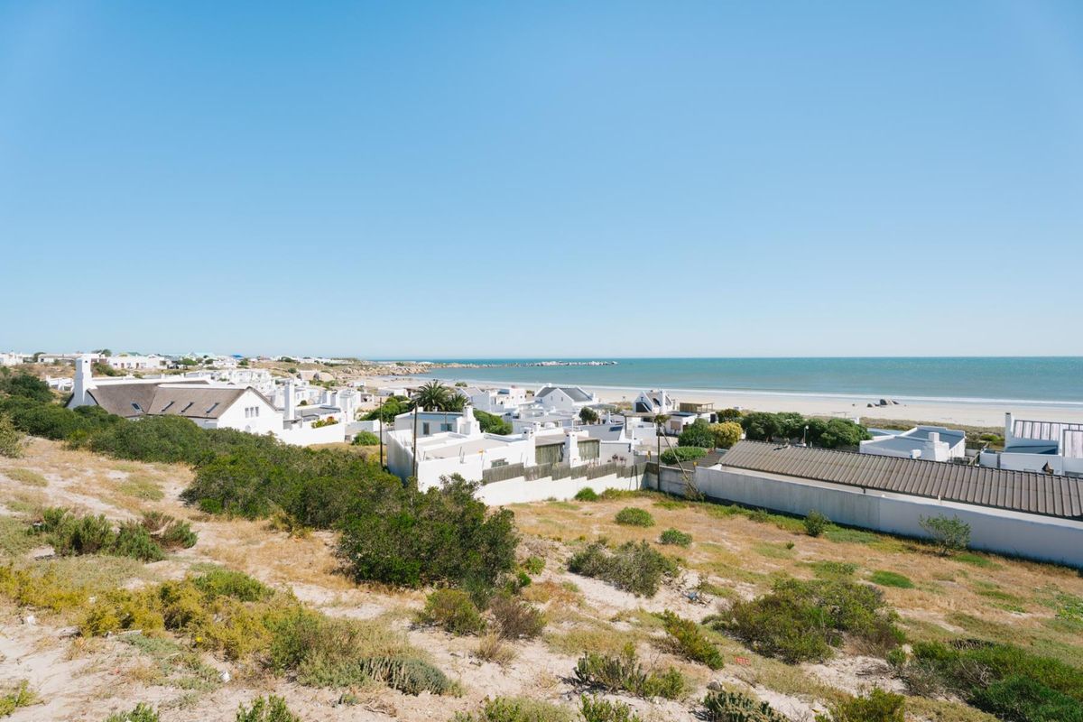 A scenic elevated view overlooking a coastal residential area and the ocean.