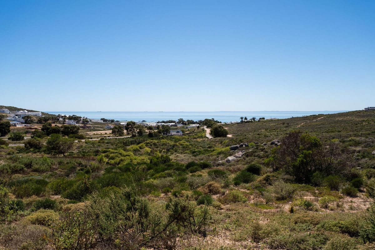 A scenic elevated view of the coastal landscape and surrounding natural vegetation, showcasing the property's expansive outlook.