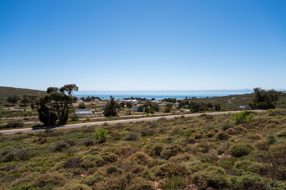 A scenic elevated view overlooking the surrounding coastal landscape, natural vegetation, and distant ocean horizon.