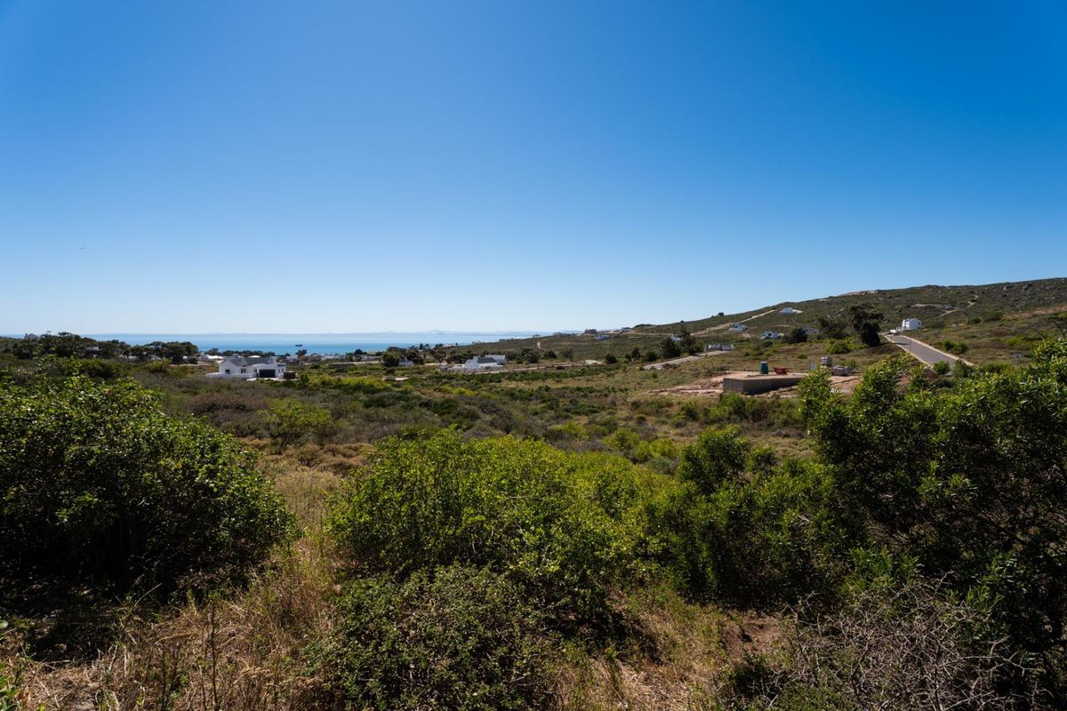 A scenic view overlooking the surrounding coastal landscape and natural vegetation, showcasing the property's elevated position and outlook.