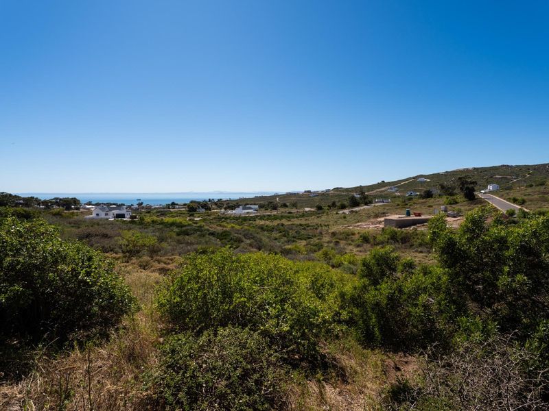 A scenic view overlooking the surrounding coastal landscape and natural vegetation, showcasing the property's elevated position and outlook.