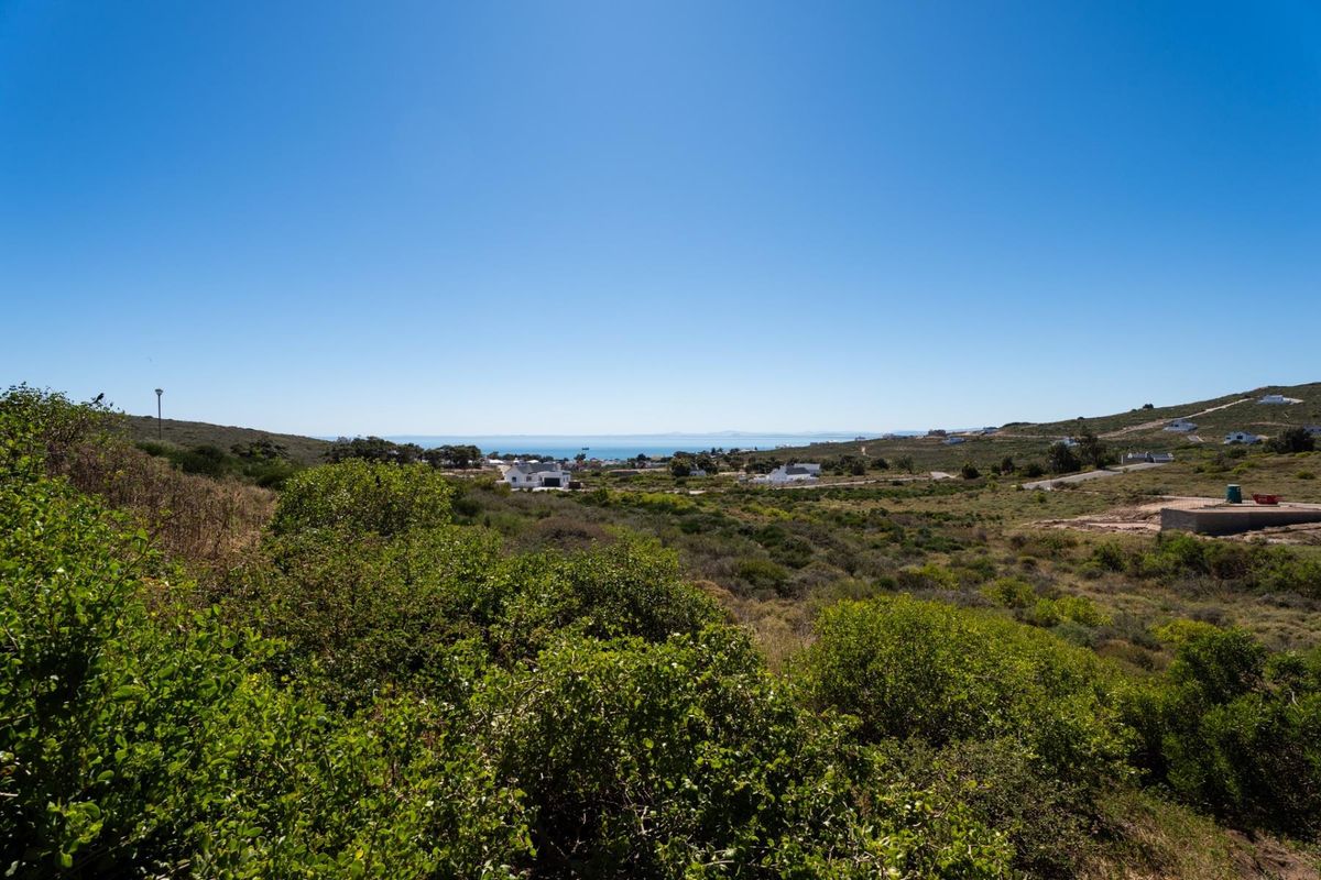 A scenic elevated view overlooking the surrounding coastal landscape and natural vegetation, showcasing the property's expansive outlook.