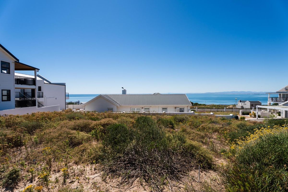 A scenic view overlooking the coastal landscape and ocean, showcasing the property's prime location and natural surroundings.