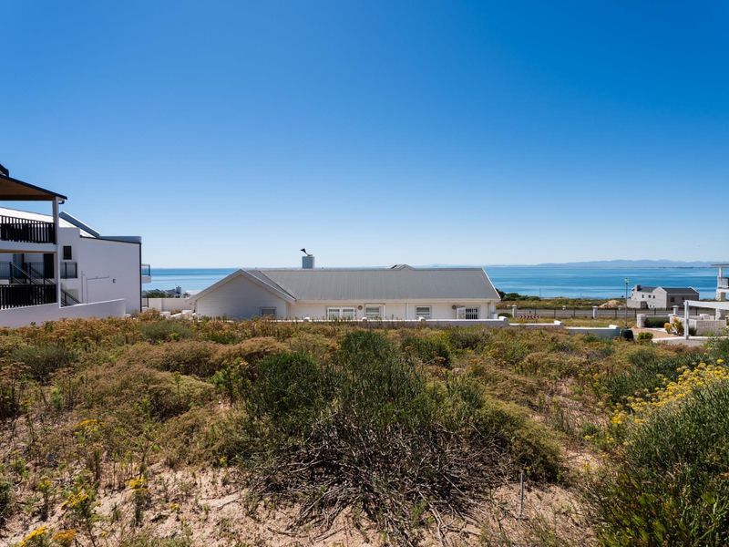 A scenic view overlooking the coastal landscape and ocean, showcasing the property's prime location and natural surroundings.