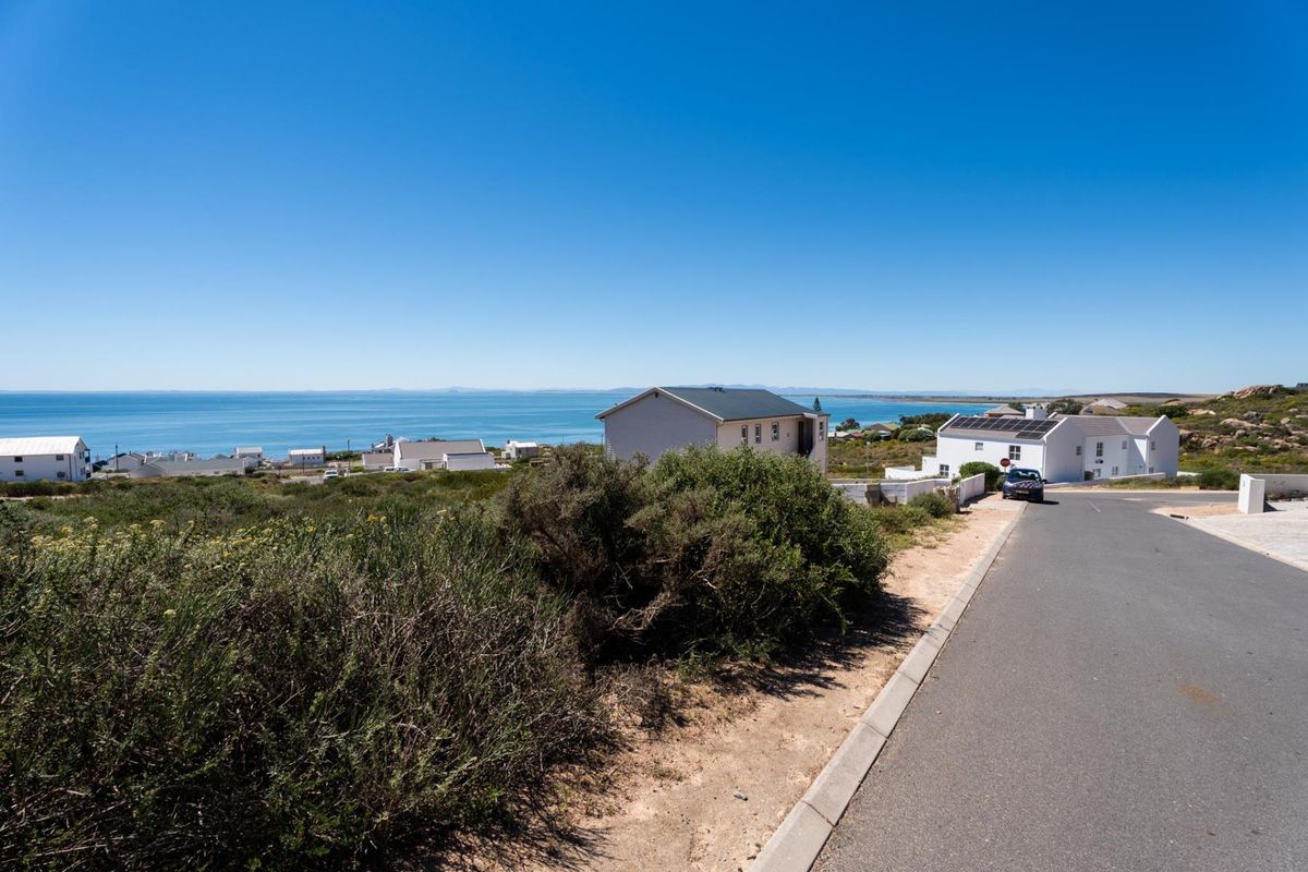 A scenic view of the coastal landscape and surrounding residential neighborhood from the street level.