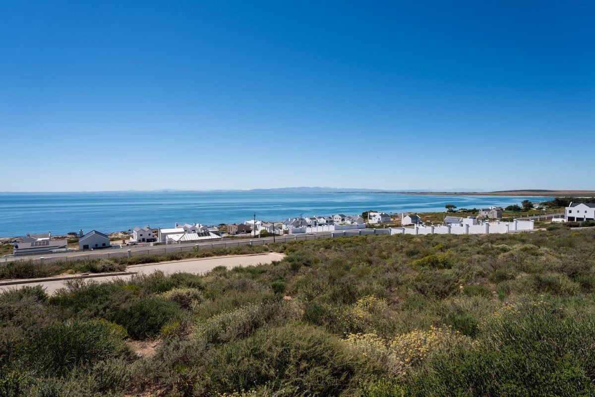 An elevated view overlooking the coastal landscape, ocean, and surrounding residential neighborhood.